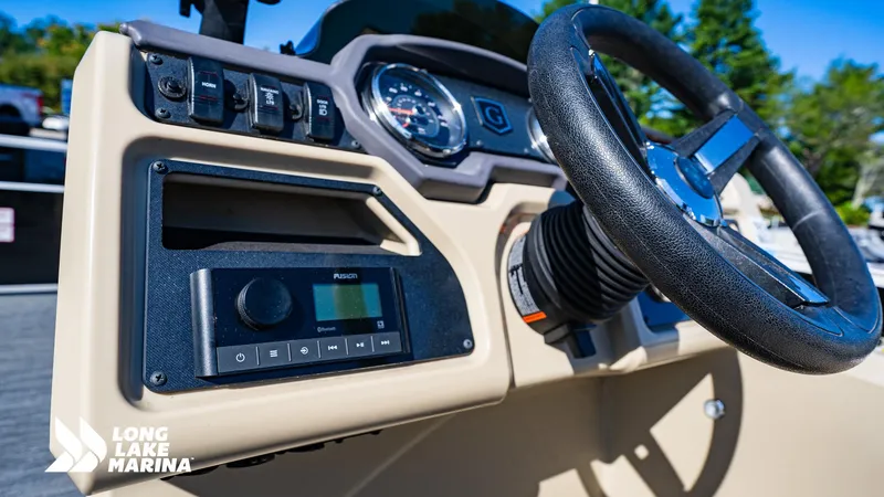 Slide: The Image of 2023 Godfrey Sw2286SB boat dashboard with steering wheel and control panel at Long Lake Marina. - 9