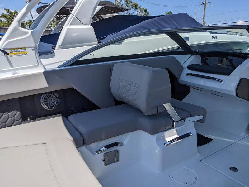 Slide: The Image of 2023 Four Winns H2 boat interior with gray seating and modern design. - 14