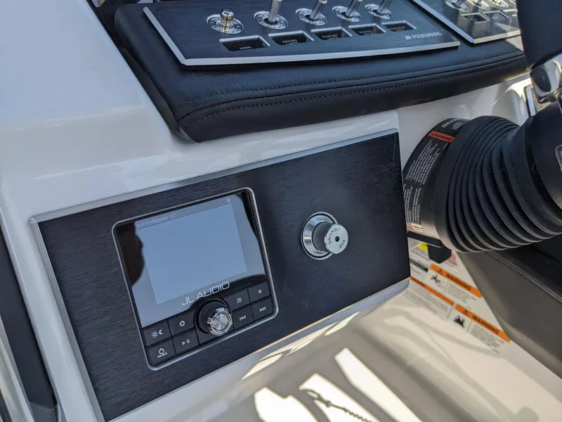 Slide: The Image of 2023 Four Winns H2 boat dashboard with JL Audio system and control panel. - 20