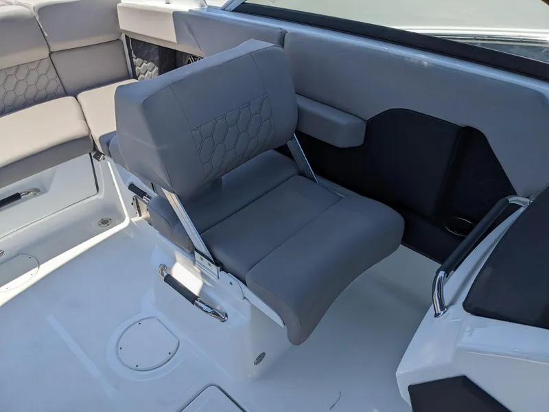 Slide: The Image of 2023 Four Winns H2 boat interior with gray seating and modern design. - 21