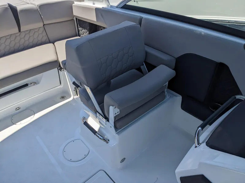 Slide: The Image of 2023 Four Winns H2 boat interior with gray seating and modern design. - 22
