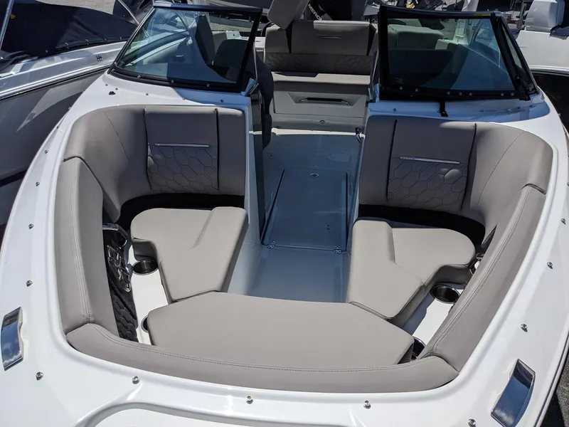 Slide: The Image of 2023 Four Winns H2 boat interior with spacious seating and modern design. - 26