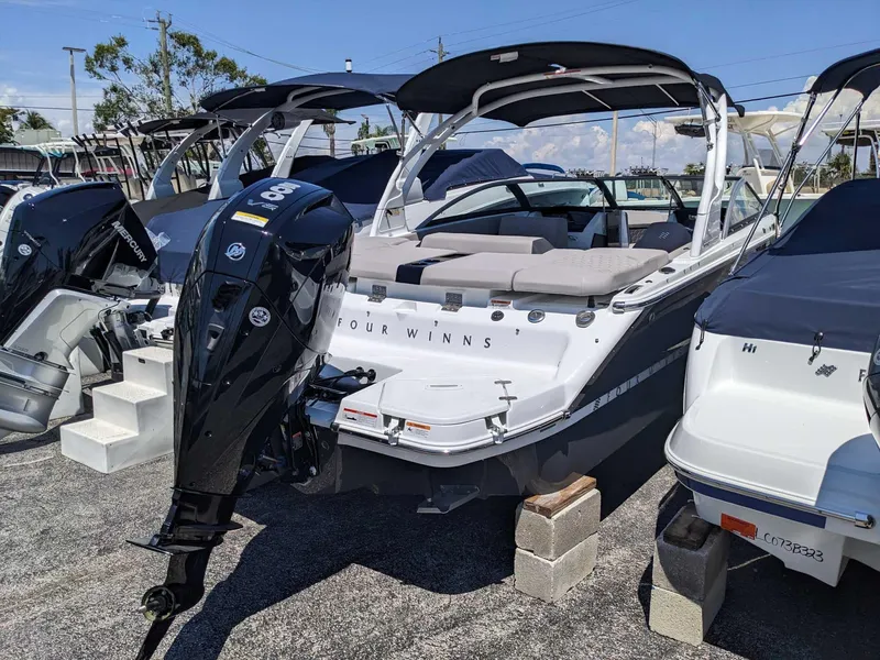 Slide: The Image of 2023 Four Winns H2 boat with outboard motor on display. - 4