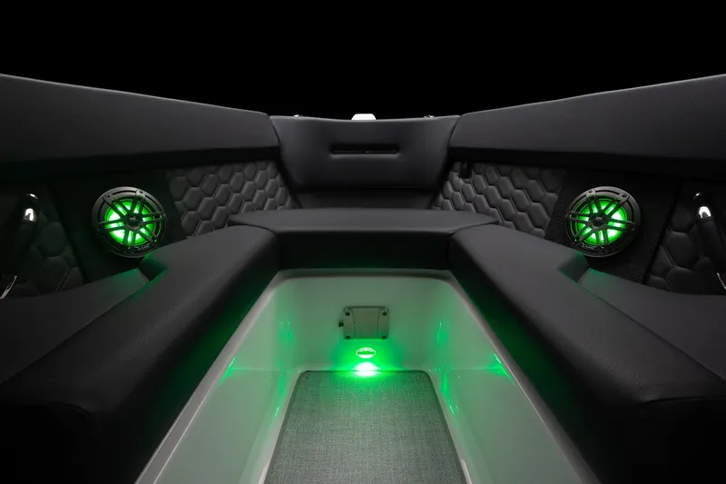 Slide: The Image of 2023 Four Winns H2 boat interior with green LED lighting and premium seating. - 44
