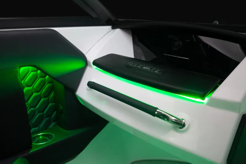 Slide: The Image of 2023 Four Winns H2 boat interior with green LED lighting and modern design. - 45