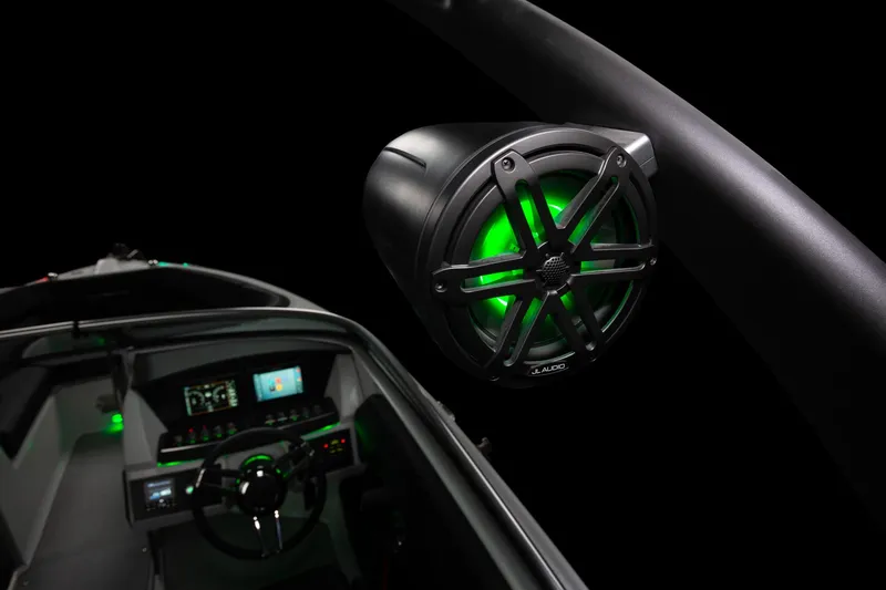 Slide: The Image of 2023 Four Winns H2 boat interior with illuminated speaker and dashboard. - 48