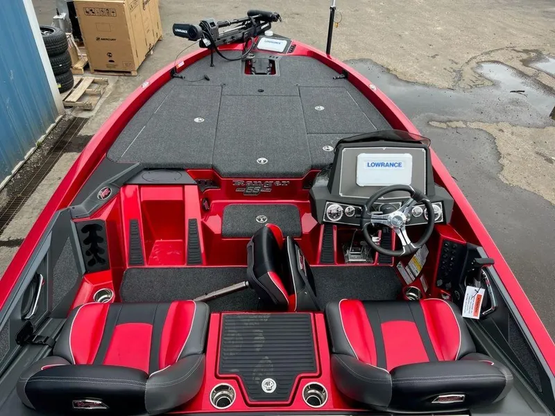 Slide: The Image of 2023 Ranger Z519 boat interior with red and black seats, steering wheel, and Lowrance electronics. - 4