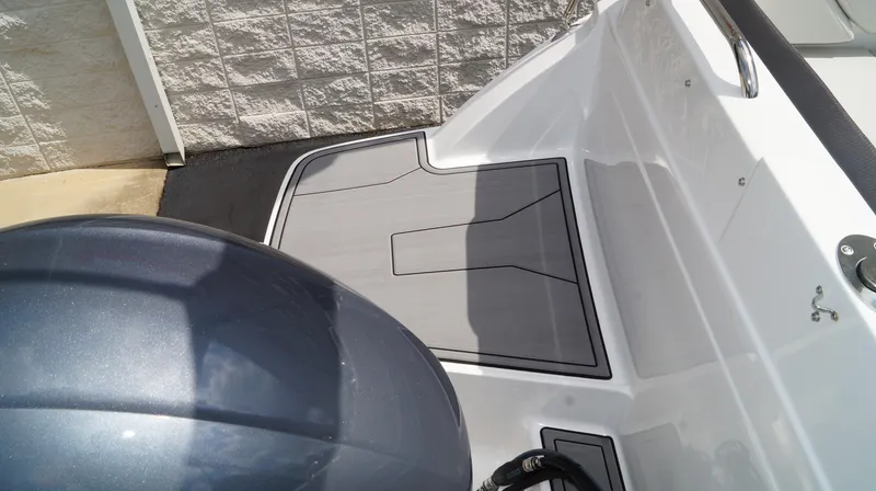 Slide: The Image of 2023 Hurricane SunDeck 235 OB boat deck and outboard motor. - 17