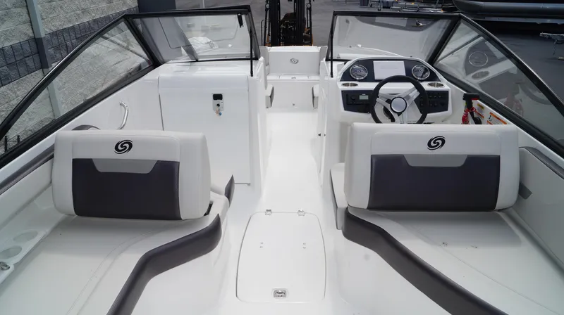Slide: The Image of 2023 Hurricane SunDeck 235 OB boat interior with dual seating and modern dashboard. - 5