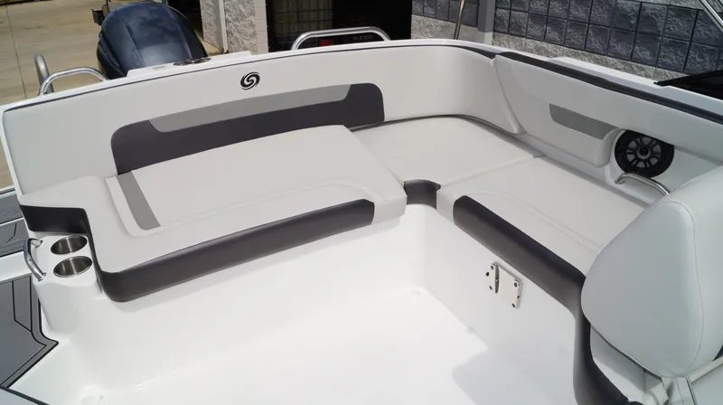 Slide: The Image of 2023 Hurricane SunDeck 235 OB boat interior with white and gray seating. - 7