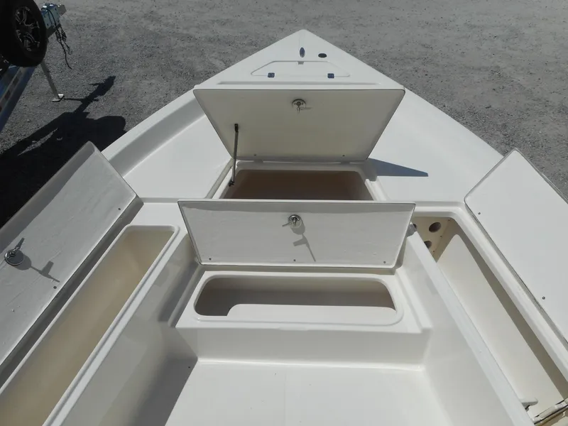 Slide: The Image of 2023 Bulls Bay 2400 boat with open storage compartments. - 5
