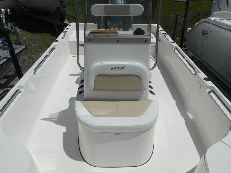 Slide: The Image of 2023 Bulls Bay 2400 boat interior with seating and console. - 8