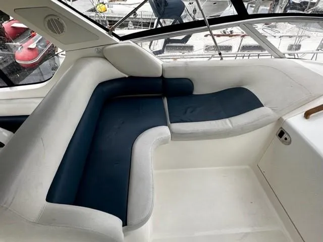 Slide: The Image of 2005 Cranchi 37 Smeraldo boat interior with blue and white seating. - 15