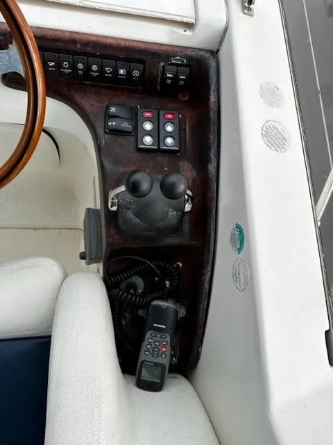 Slide: The Image of Control panel of a 2005 Cranchi 37 Smeraldo boat with steering wheel and radio. - 20