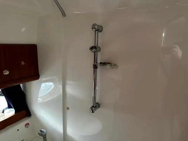 Slide: The Image of Interior of 2005 Cranchi 37 Smeraldo yacht, featuring a sleek shower area. - 23