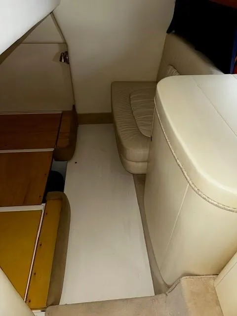Slide: The Image of 2005 Cranchi 37 Smeraldo interior with beige seating and wooden accents. - 34