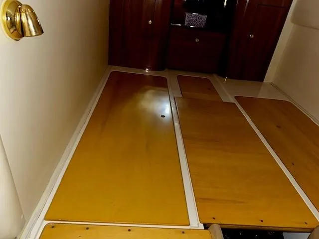 Slide: The Image of Interior view of 2005 Cranchi 37 Smeraldo yacht with wooden flooring and cabinets. - 35