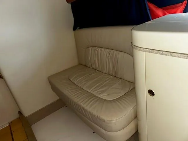 Slide: The Image of Interior of 2005 Cranchi 37 Smeraldo yacht with beige leather seating. - 36