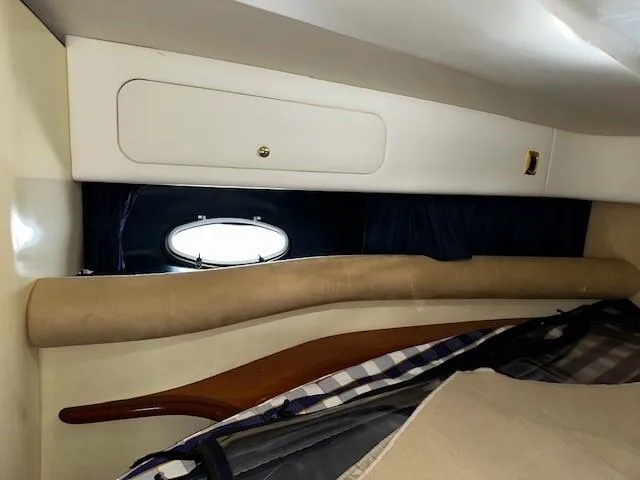Slide: The Image of Interior cabin of 2005 Cranchi 37 Smeraldo yacht with porthole and storage. - 39