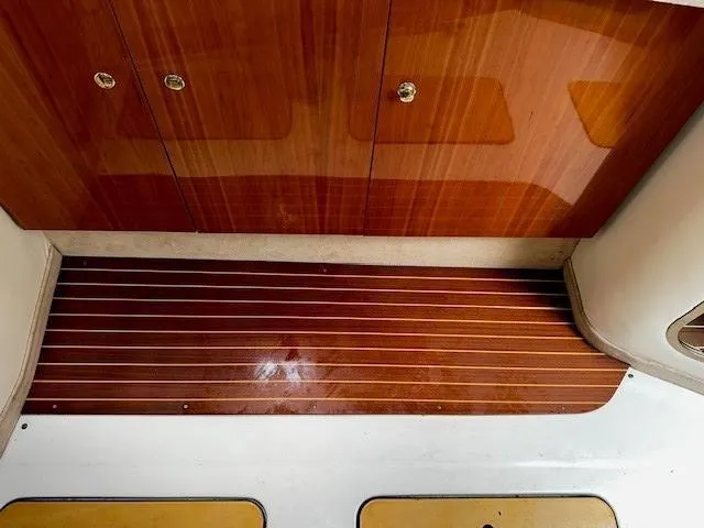 Slide: The Image of 2005 Cranchi 37 Smeraldo interior with polished wood flooring and cabinetry. - 41