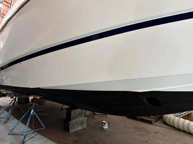 Slide: The Image of 2005 Cranchi 37 Smeraldo boat hull in dry dock, supported by stands. - 43