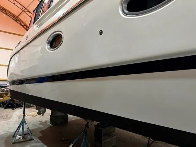 Slide: The Image of 2005 Cranchi 37 Smeraldo yacht in dry dock, side view showing hull details. - 45