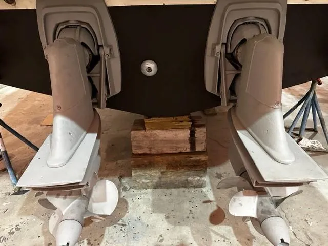 Slide: The Image of 2005 Cranchi 37 Smeraldo boat propellers in a workshop setting. - 46