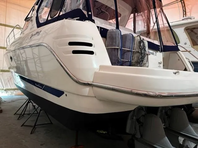 Slide: The Image of 2005 Cranchi 37 Smeraldo yacht in storage, rear view with protective covers. - 48