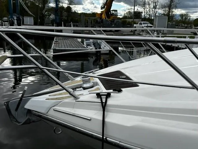 Slide: The Image of 2005 Cranchi 37 Smeraldo yacht docked at marina, featuring sleek bow design. - 7