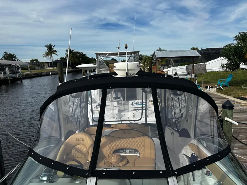 Slide: The Image of 2001 Sea Ray 340 Sundancer docked at a marina with clear skies. - 10