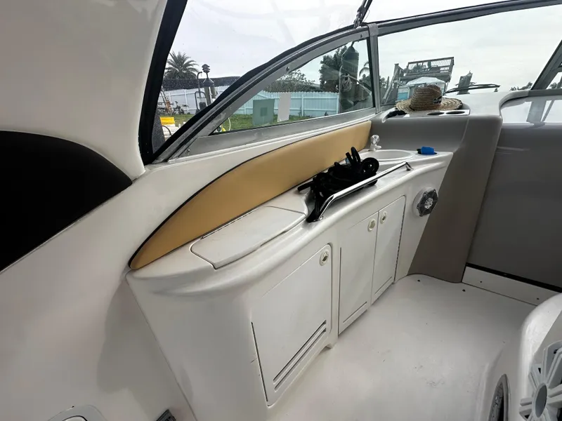 Slide: The Image of Interior view of 2001 Sea Ray 340 Sundancer boat with storage cabinets. - 18