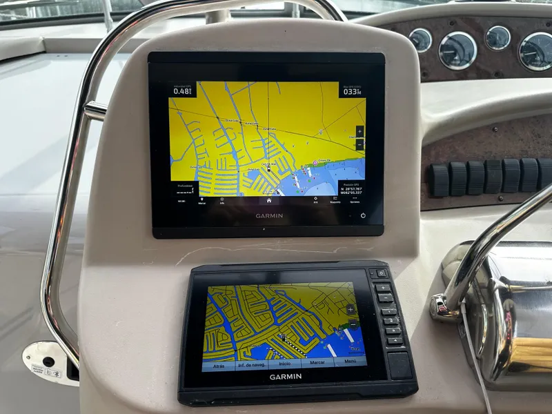 Slide: The Image of Garmin navigation screens on a 2001 Sea Ray 340 Sundancer boat dashboard. - 22