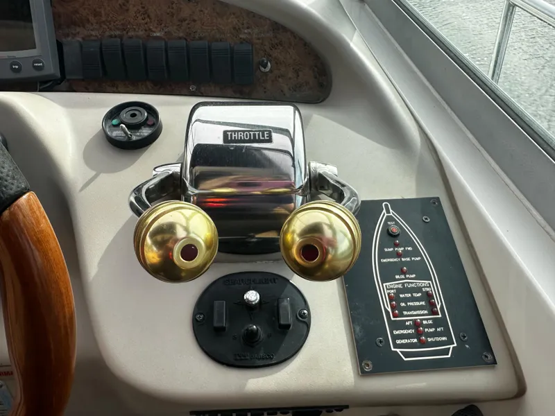 Slide: The Image of Throttle controls on a 2001 Sea Ray 340 Sundancer boat. - 23