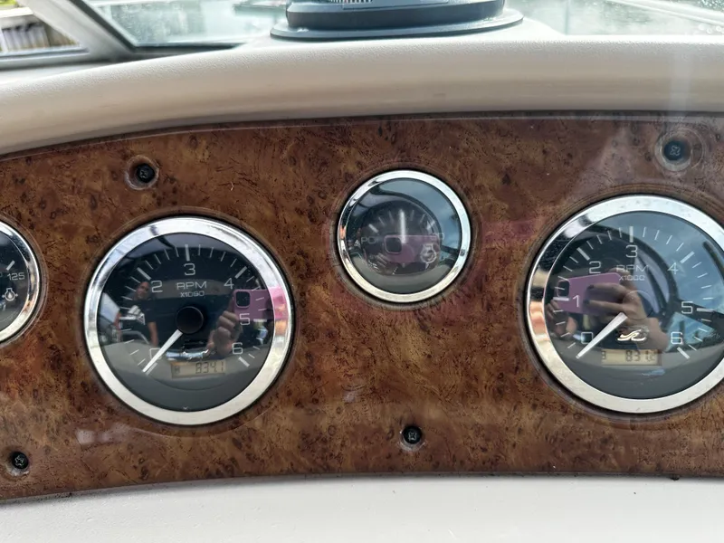 Slide: The Image of Close-up of 2001 Sea Ray 340 Sundancer dashboard gauges. - 26