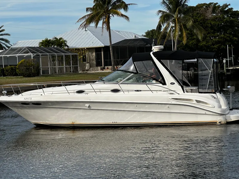 Slide: The Image of 2001 Sea Ray 340 Sundancer yacht cruising on a calm waterway. - 3