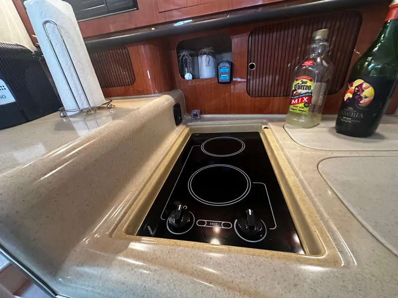 Slide: The Image of 2001 Sea Ray 340 Sundancer kitchen with electric stove and countertop. - 37