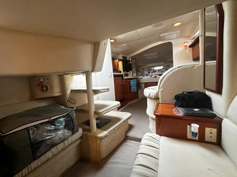 Slide: The Image of Interior of 2001 Sea Ray 340 Sundancer yacht with cozy seating and kitchen area. - 39