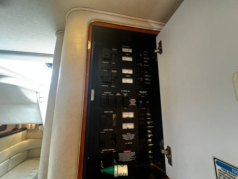Slide: The Image of Electrical panel inside a 2001 Sea Ray 340 Sundancer boat. - 46
