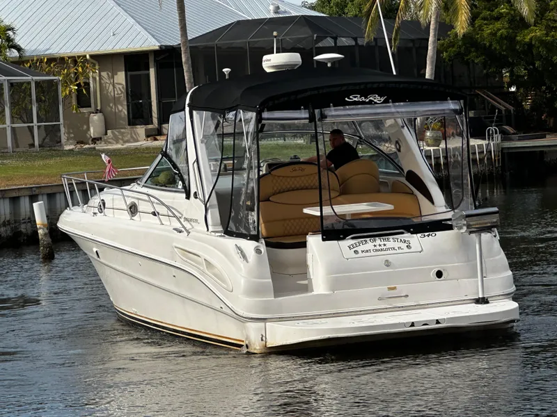 Slide: The Image of 2001 Sea Ray 340 Sundancer boat docked in a canal. - 5