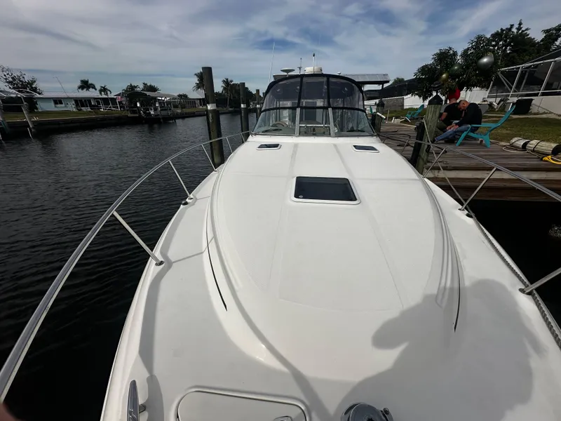 Slide: The Image of 2001 Sea Ray 340 Sundancer docked at a marina. - 9