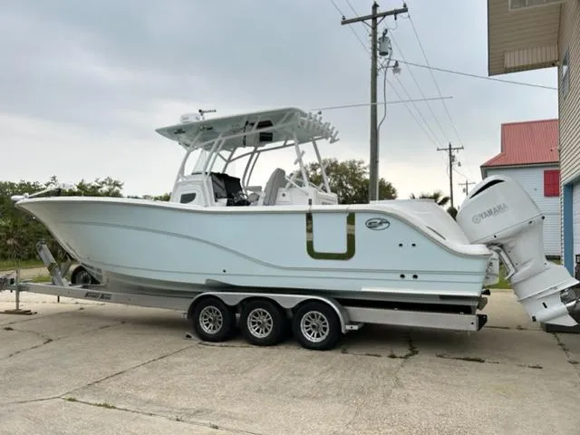 The Image of 2019 Sea Fox 328 Commander boat on a trailer, parked outdoors. - 1