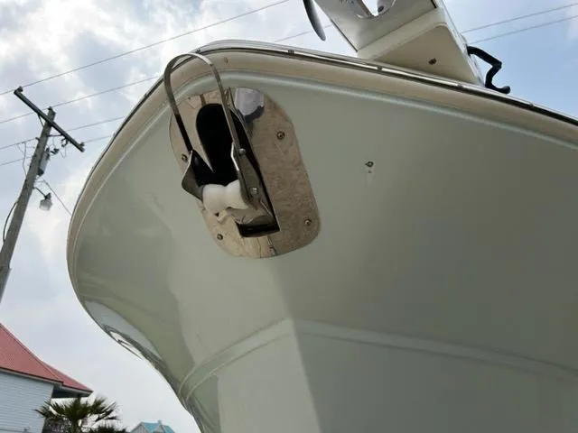 Slide: The Image of 2019 Sea Fox 328 Commander boat bow with anchor detail under cloudy sky. - 10