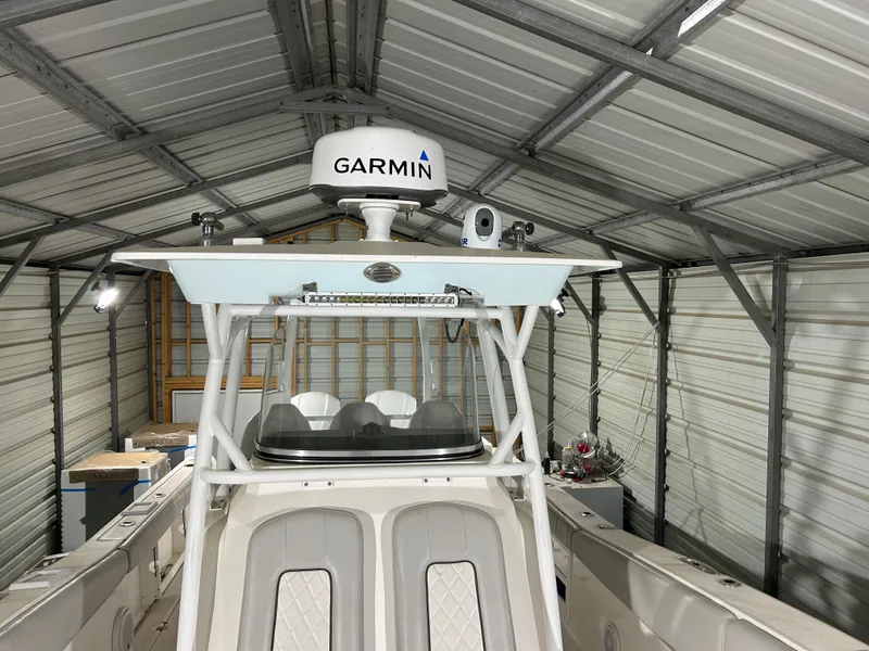 Slide: The Image of 2019 Sea Fox 328 Commander boat with Garmin radar in a metal storage shed. - 11