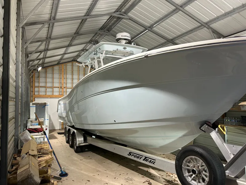 Slide: The Image of 2019 Sea Fox 328 Commander boat on trailer in a covered storage area. - 3