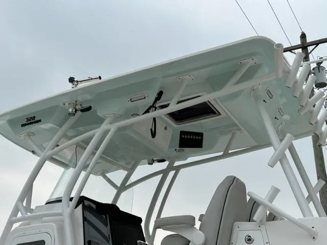 Slide: The Image of 2019 Sea Fox 328 Commander boat, featuring a sleek T-top and modern design elements. - 5
