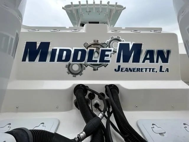 Slide: The Image of Sea Fox 328 Commander boat with "Middle Man" and "Jeanerette, LA" text on the stern. - 8