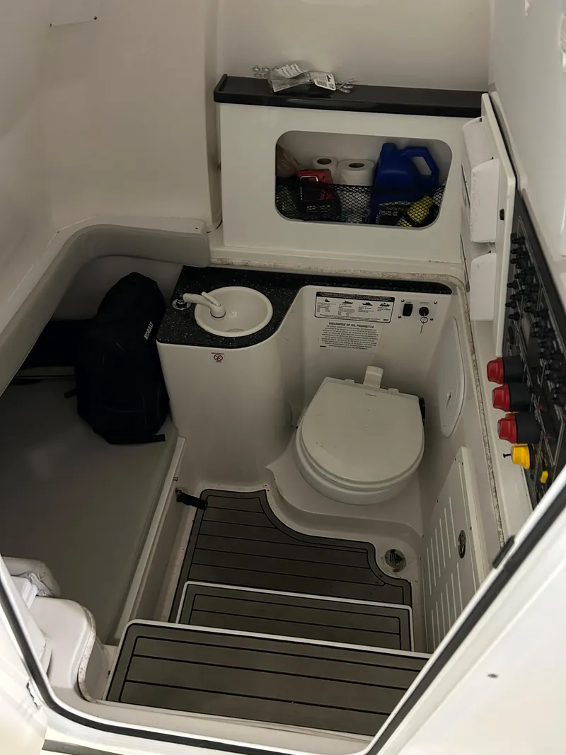 Slide: The Image of 2019 Sea Fox 328 Commander boat interior with toilet and sink. - 9