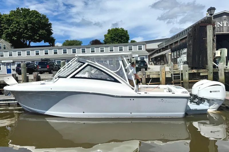 Slide: The Image of 2023 Albemarle 31 Dual Console boat docked at marina with Yamaha outboard. - 1