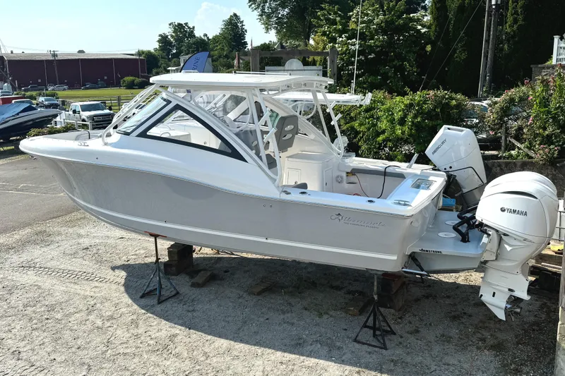 Slide: The Image of 2023 Albemarle 31 Dual Console boat on display with twin Yamaha engines. - 2