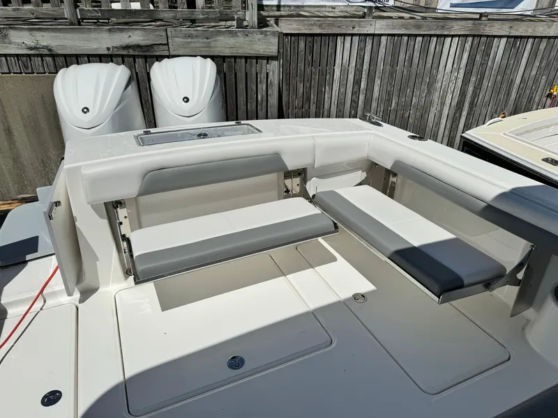 Slide: The Image of 2023 Albemarle 31 Dual Console boat with twin outboard engines and seating area. - 3
